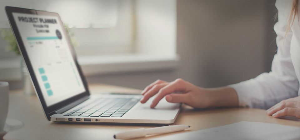 woman developing a marketing plan on computer