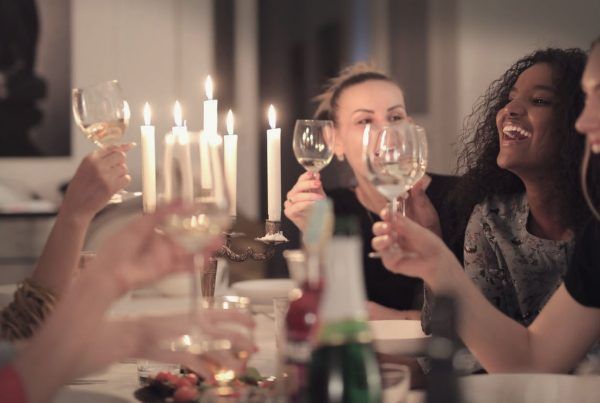 friends tasting wine at home