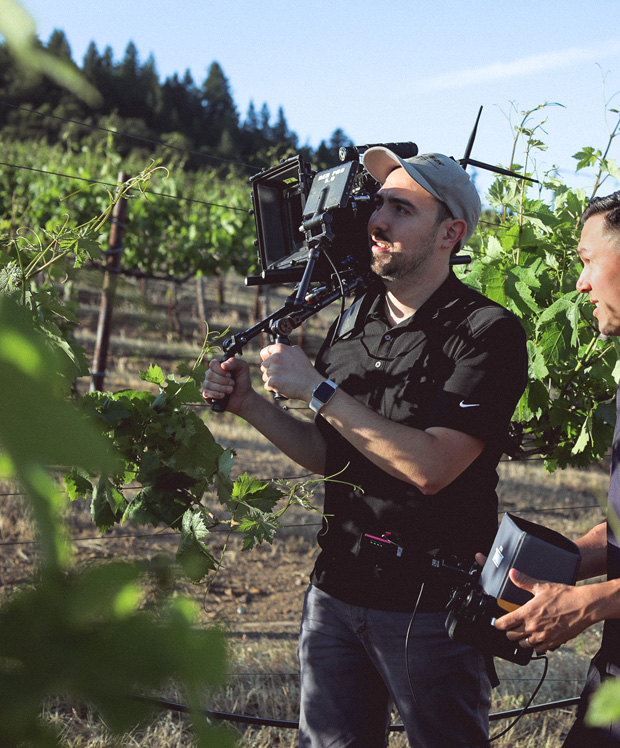 Pour video production team recording the vineyard for marketing