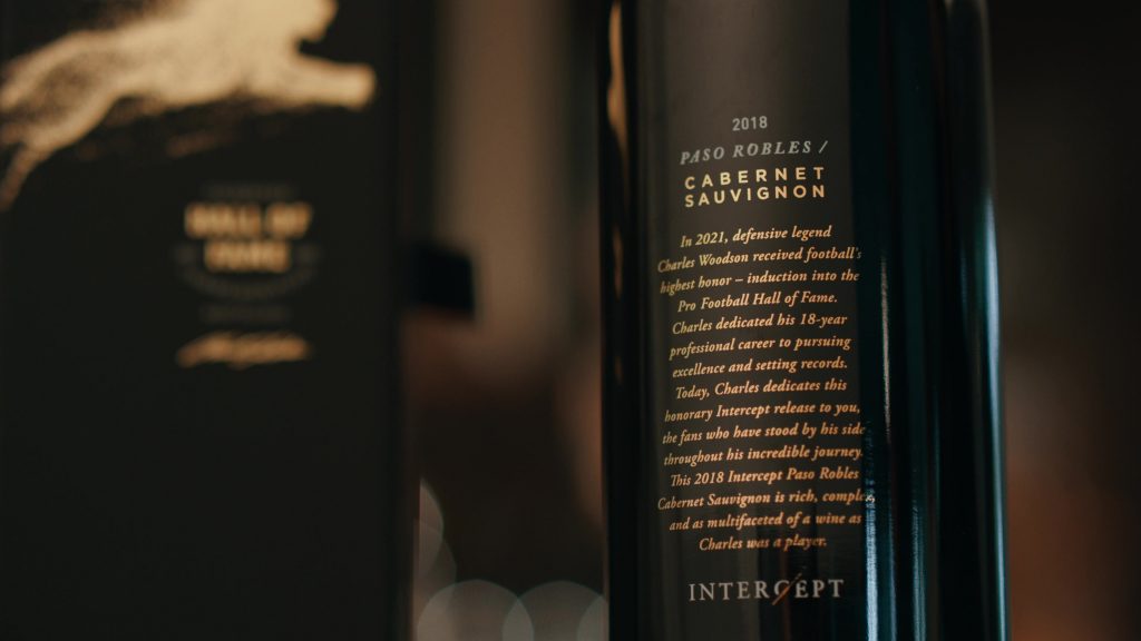 Intercept Wines Case Study Photo 13 Close-up view of a 2018 Paso Robles Cabernet Sauvignon wine bottle with an honorary label dedicated to Charles Woodson's induction into the Pro Football Hall of Fame.